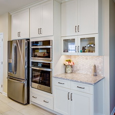 Warm-Creamy-White-Painted-Cabinetry-Paired-Organic-Wood-Grained-Timber-Kitchen-Remodel-in-East-York 3